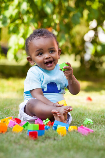 PICTURES__little_african_american_baby_boy_playing_grass_28324831